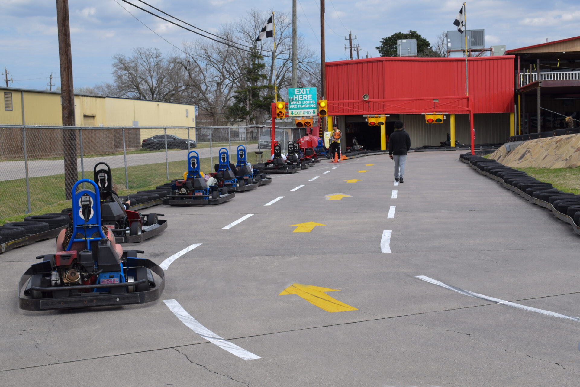 View of go karts exiting the track one after the other